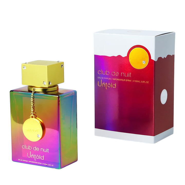 Colorful perfume bottle and packaging labeled 'club de nuit Untold' on a white background