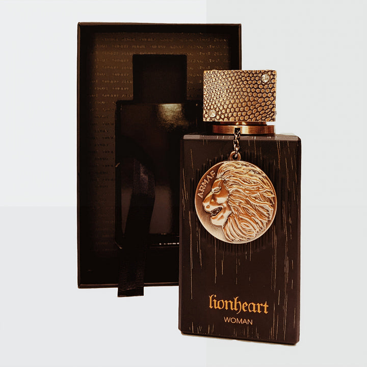 Perfume bottle with lion emblem and 'lionheart' branding on a white background
