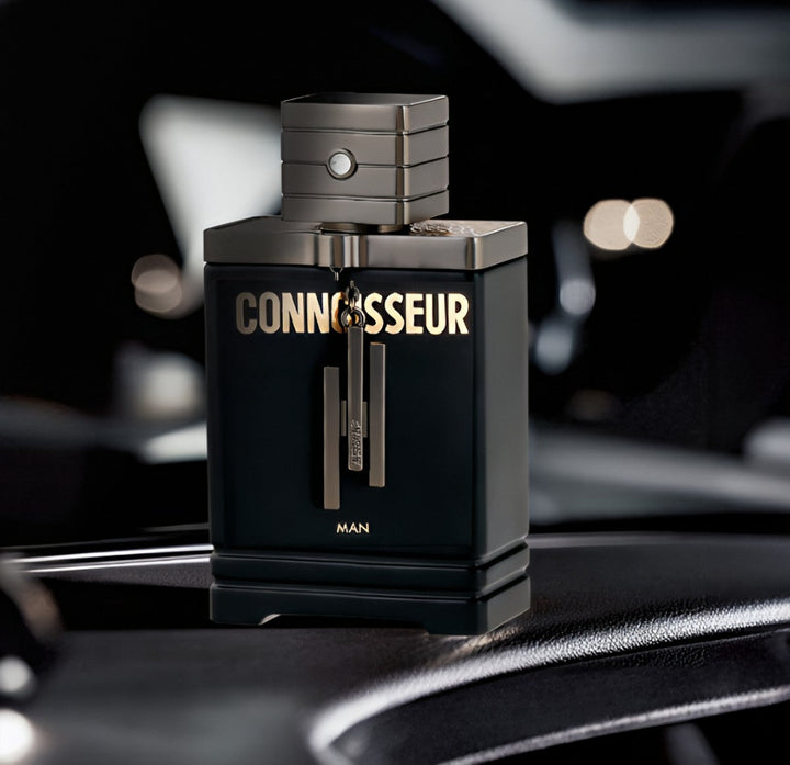 Perfume bottle labeled 'Connoisseur' on a reflective surface with blurred background Connoisseur Man Armaf for men
