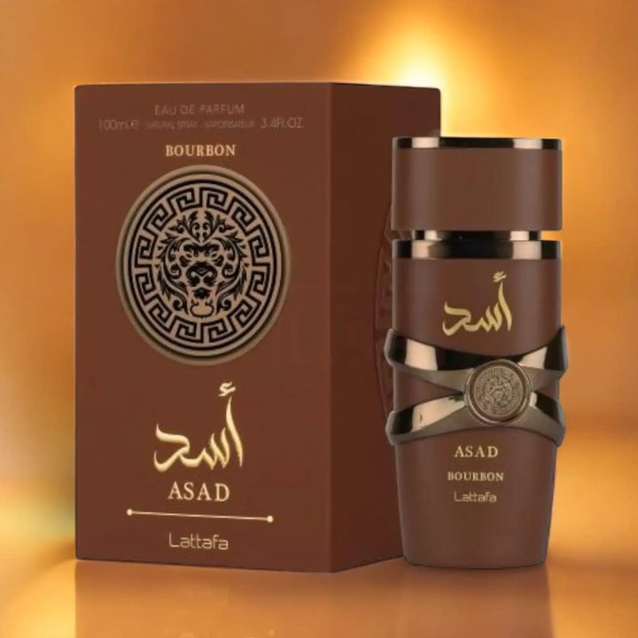 Brown perfume bottle and packaging with 'ASAD' branding on a warm orange background