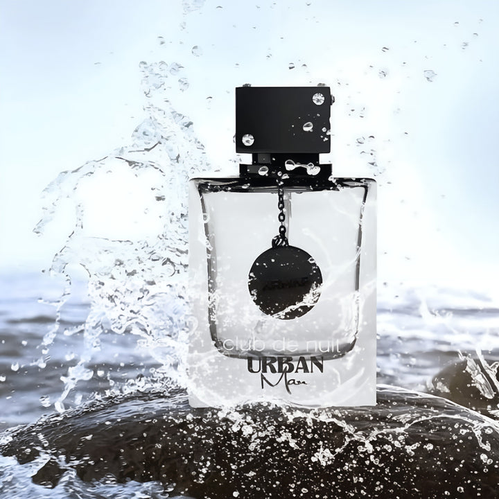 Perfume bottle labeled 'Urban Man' with water splashing around it Club de Nuit Urban Man Armaf for men

