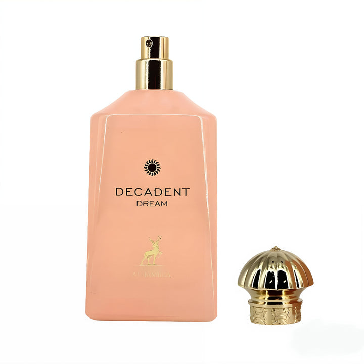 Perfume bottle labeled 'Decadent Dream' with gold cap on a white background