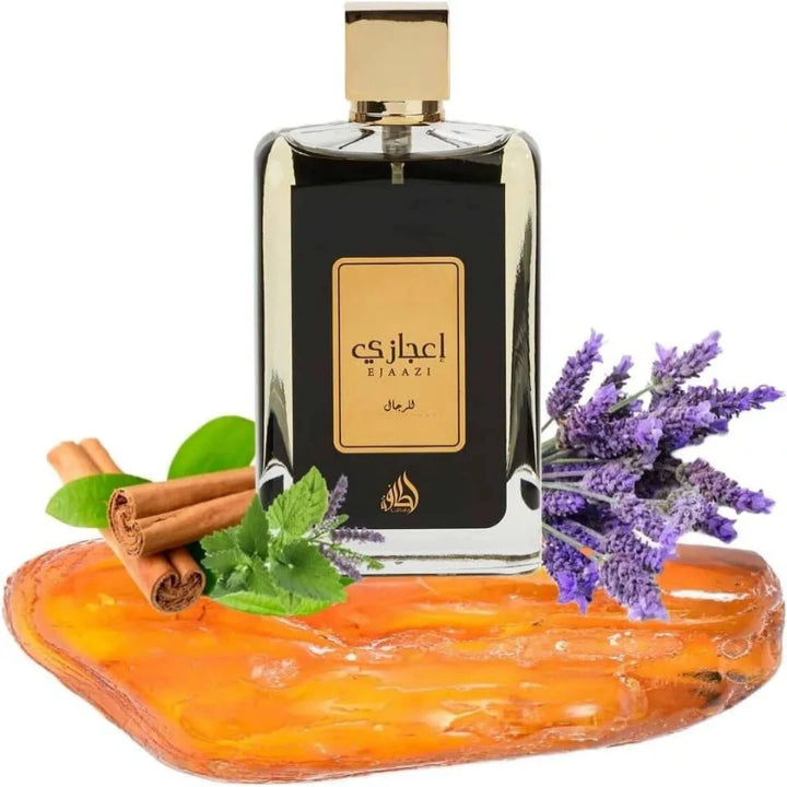 Perfume bottle with lavender, cinnamon sticks, and mint leaves on a white background