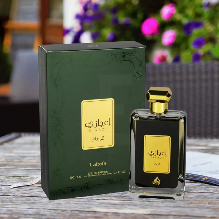 Perfume bottle and packaging with 'Lattafa' branding on a wooden surface.