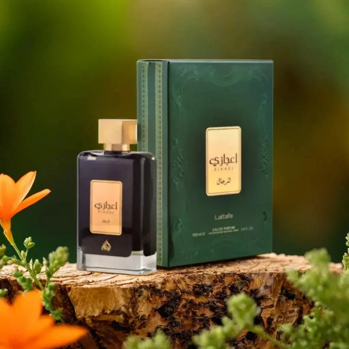 Eshel perfume bottle and packaging on a wooden surface with flowers in the background