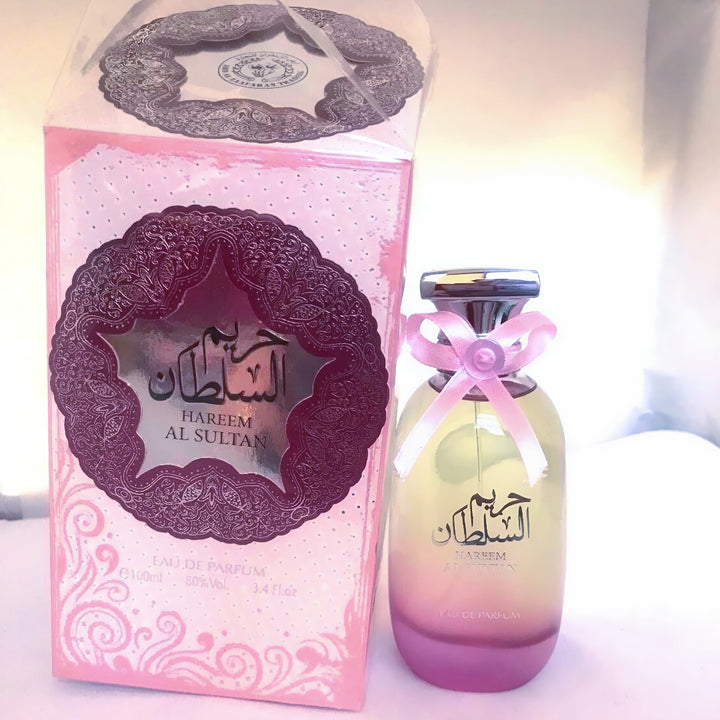 Perfume bottle and packaging with 'Hareem Al Sultan' branding on a light background