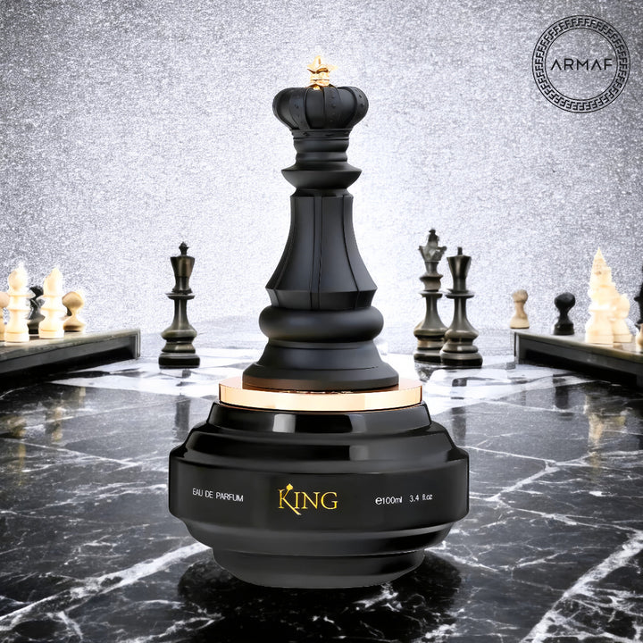 Black chess piece-shaped perfume bottle on a marble surface with Armaf logo.
