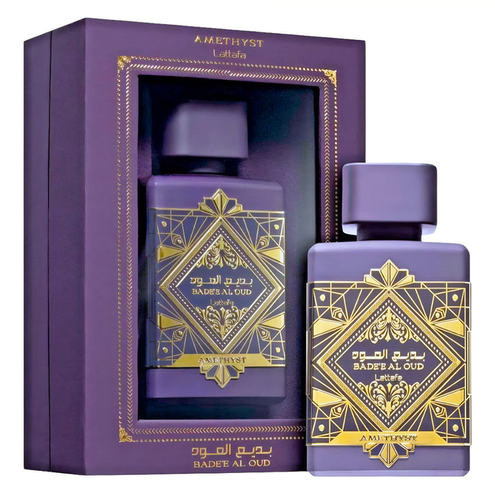 Purple perfume bottle with gold designs and matching box on a white Bade'e Al Oud Amethyst Lattafa Perfumes for women and men
background