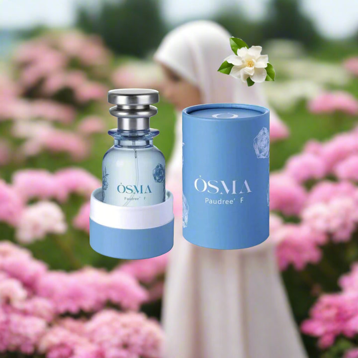 OSMALA perfume bottle and packaging with flowers and crystals on a light blue background