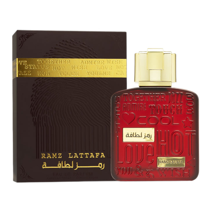 Red perfume bottle with gold cap and black packaging featuring 'Ramz Lattafa' branding on a white background.