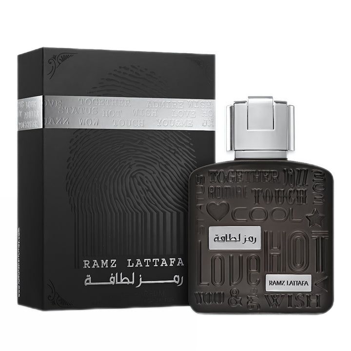Black perfume bottle and packaging with 'Ramz Lattafa' branding on a white background