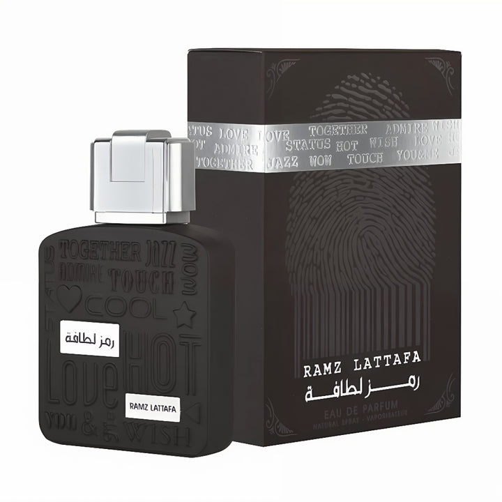 Black perfume bottle and packaging with 'Ramz Lattafa' branding on a white background