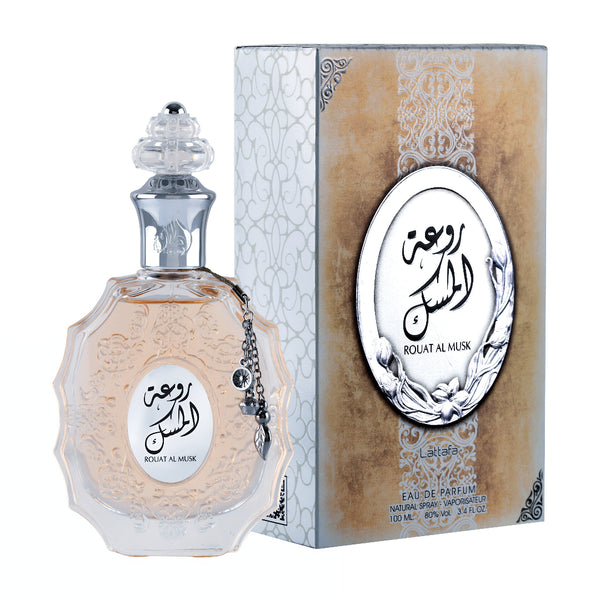 Perfume bottle and packaging of Rouat Al Musk with intricate designs on a white background