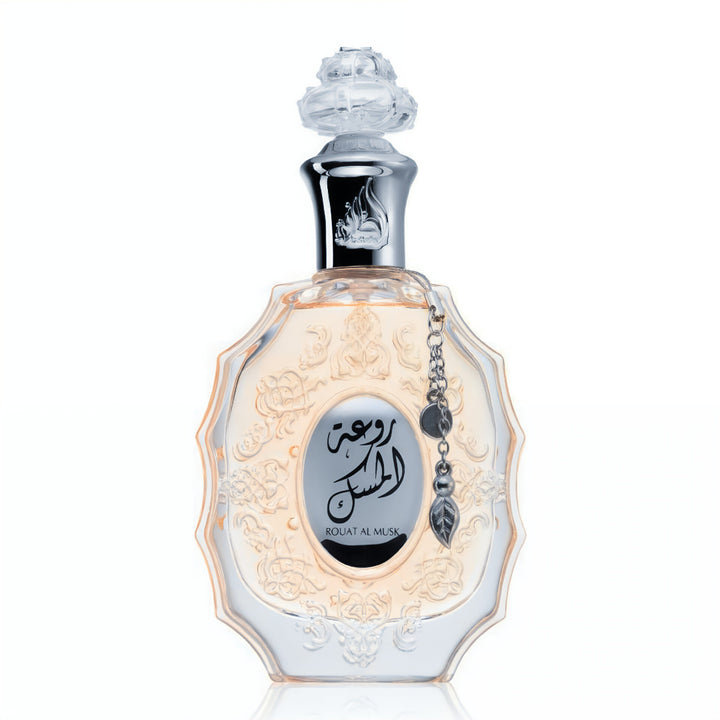 Perfume bottle with intricate design and Arabic text on a white background Wangi World Perfume Malaysia