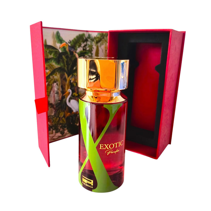 Rue Broca Exotic Paradise  Perfume bottle with gold cap and red packaging featuring a scenic design.