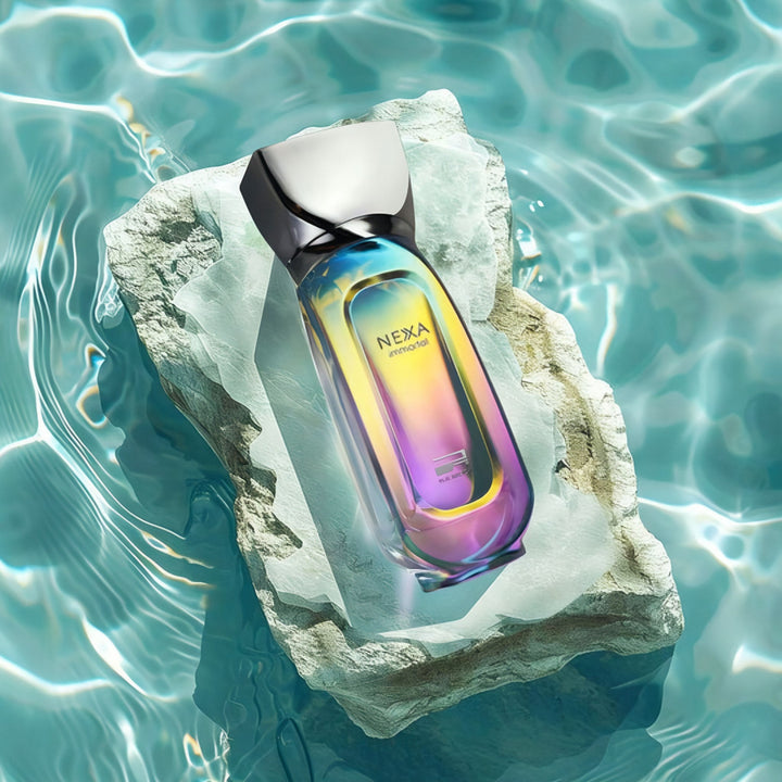 Nexa Immortal Rue Broca perfume bottle on a rock with water background