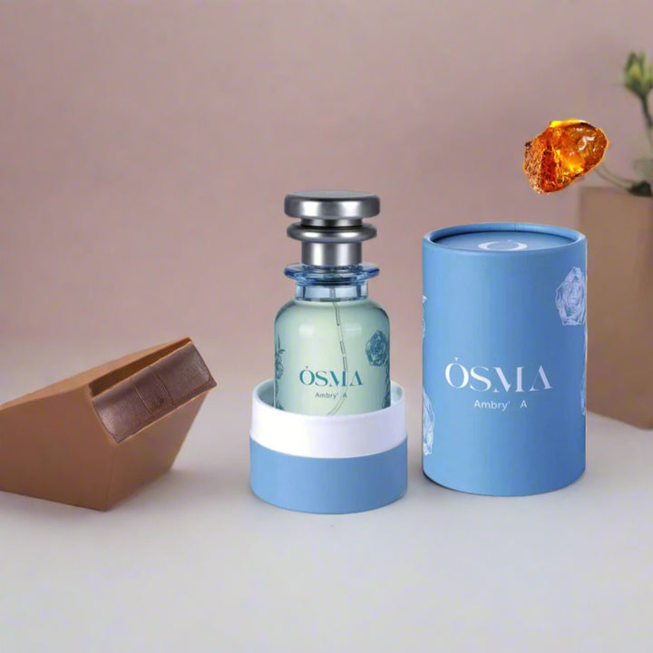 OSMA perfume bottle and packaging on a light blue background with ingredients displayed.