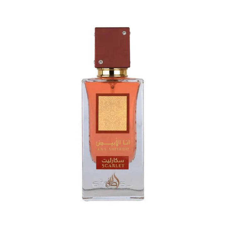 Perfume bottle with a red cap and clear body on a white background