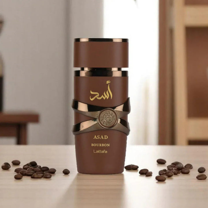 Brown bottle with gold accents on a table with coffee beans