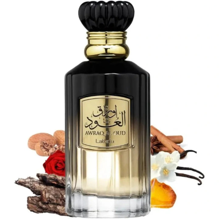 Perfume bottle with gold cap and label, surrounded by spices and flowers on a white background