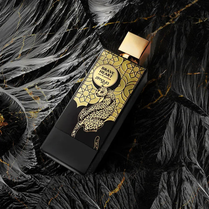 Perfume bottle with gold and black design on a textured black background