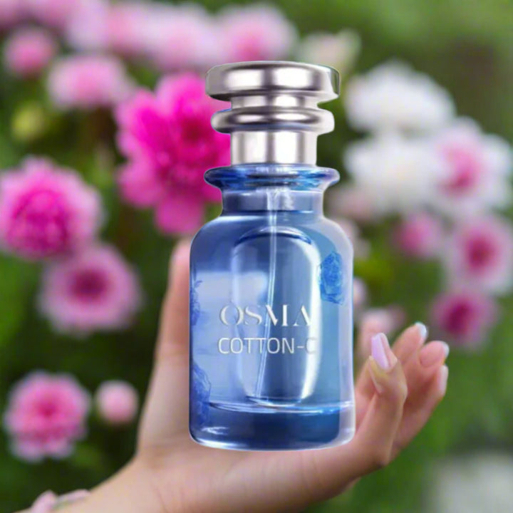 Blue perfume bottle labeled 'Osmia Cotton' with 'Parfumo' logo on a white background