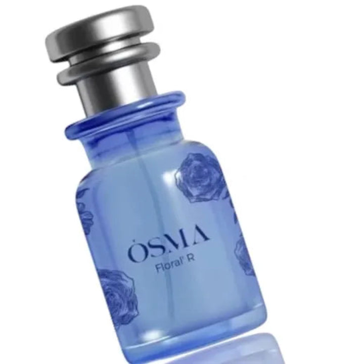 Blue perfume bottle with silver cap on a white background