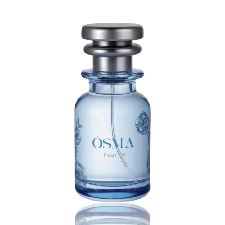 Blue perfume bottle with silver cap on a white background