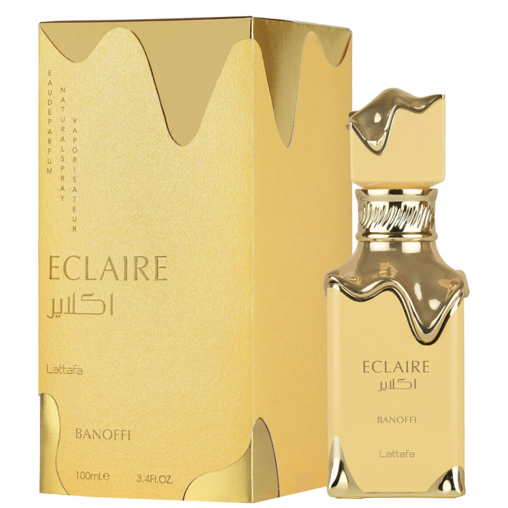 Gold Eclaire perfume bottle and packaging on a white background