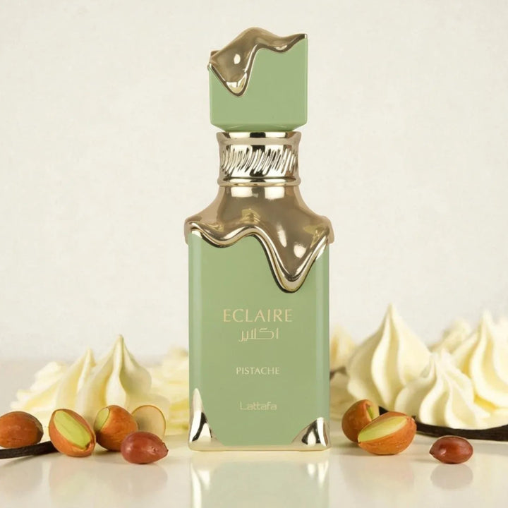 Green perfume bottle with pistachio nuts and cream on a light background