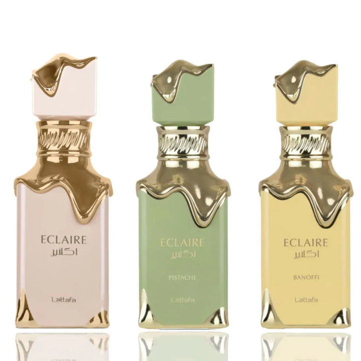 Three Eclaire perfume bottles in different colors on a white background