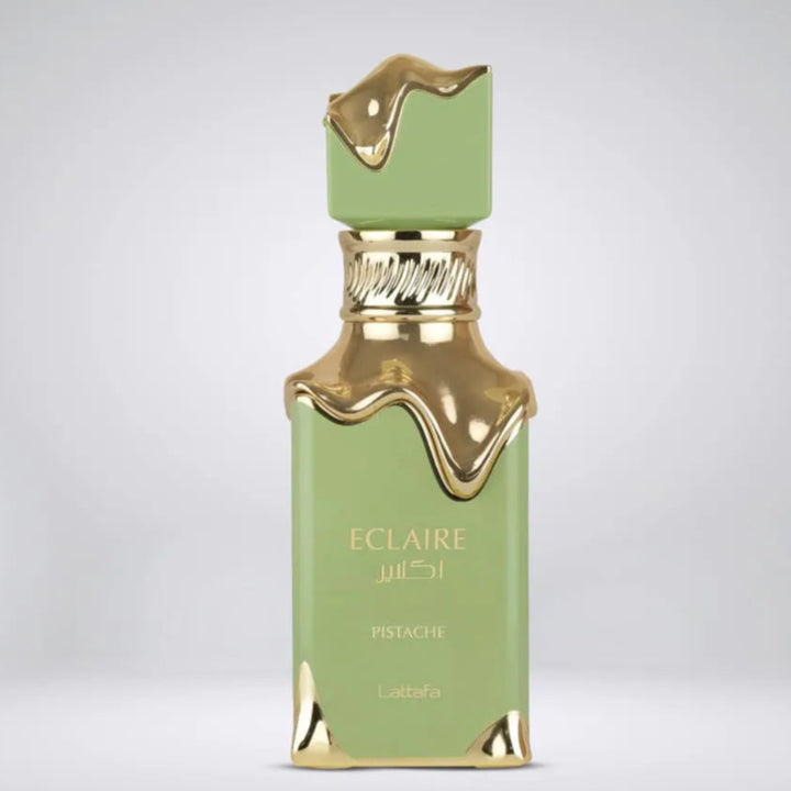 Green and gold perfume bottle with 'Eclaire' branding on a light gray background.