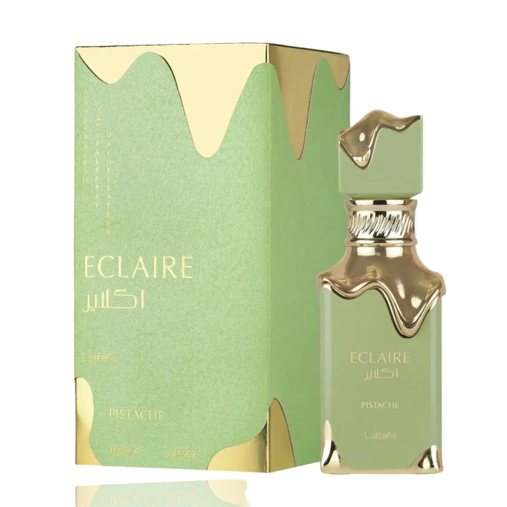 Eclaire perfume bottle and packaging with gold accents on a white background