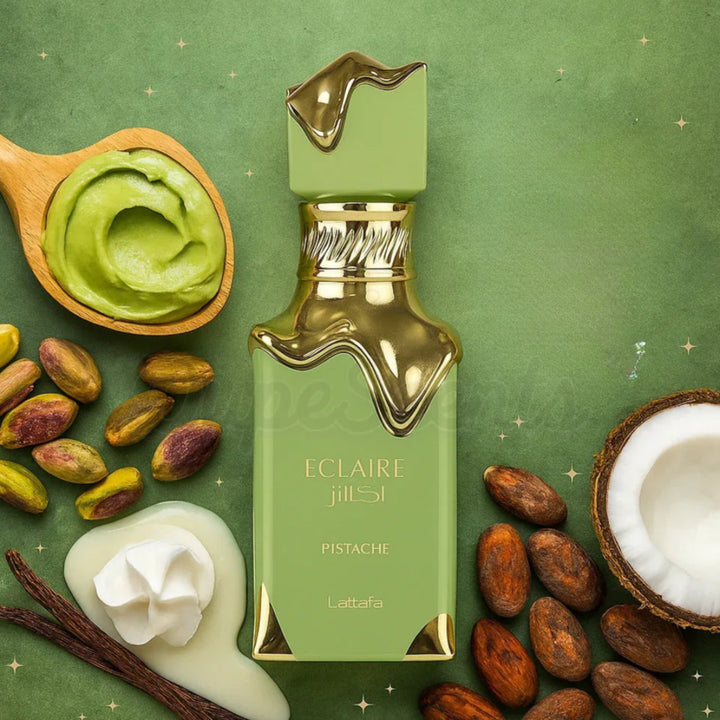 Green perfume bottle with pistachio flavor surrounded by pistachios, coconut, and vanilla beans on a green background.