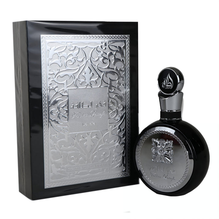 Black perfume bottle and packaging Lattafa fakhar silver  with intricate design on a white background