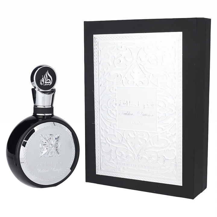Black and silver perfume bottle with decorative box on a white background Lattafa fakhar silver 