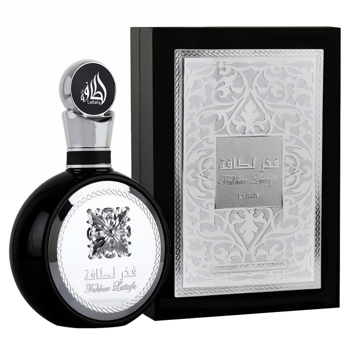 Perfume bottle and packaging Lattafa fakhar silver  with intricate design on a white background
