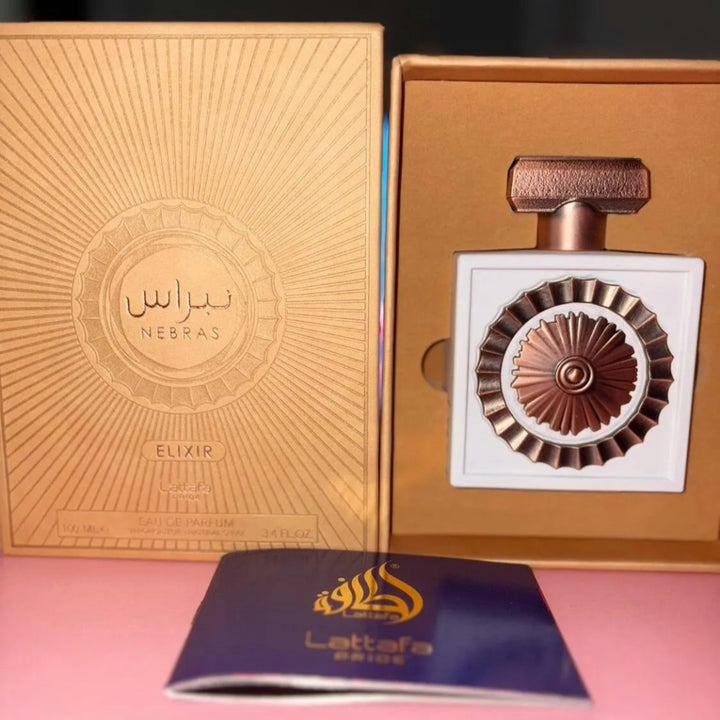 Nerbas Elixir perfume bottle with packaging on a pink background
