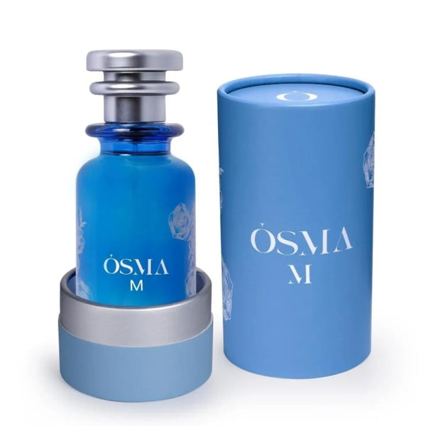 Blue Osma M perfume bottle with matching cylindrical container on a white background