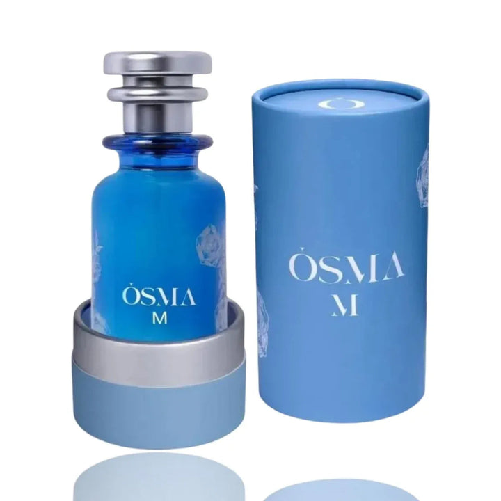Blue perfume bottle with silver cap and cylindrical container labeled 'OSMA M' on a white background