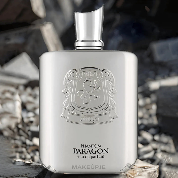 Perfume bottle labeled 'Phantom Paragon' by MAKEUP.IE on a stone surface with blurred natural background