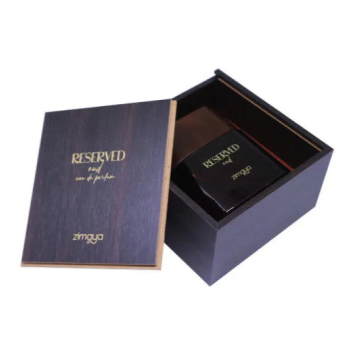 Open black perfume box with 'Reserved' and 'zimaya' branding on a white background
