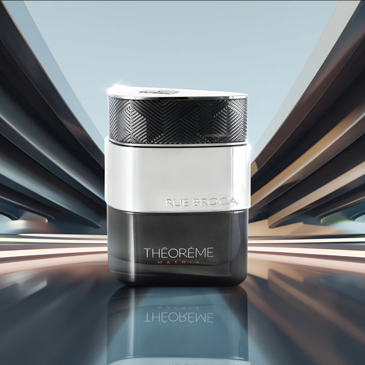 Rue Broca Théorème perfume bottle on a reflective surface with a modern background