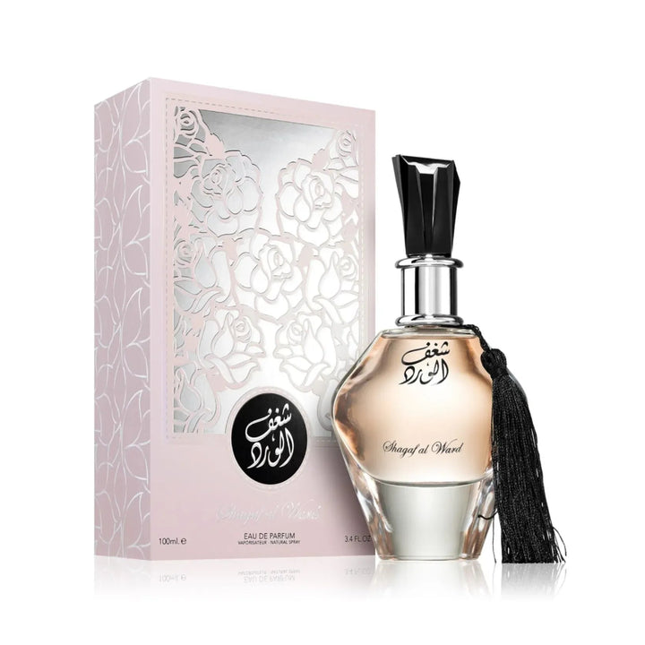 Perfume bottle with tassel and packaging on a white background