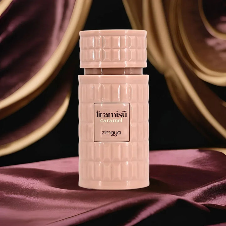 Pink bottle of Zimgya Tiramisu Caramel perfume on a dark background