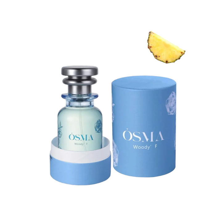 OSMA Woody perfume bottle and packaging on a light blue background with ingredients displayed.