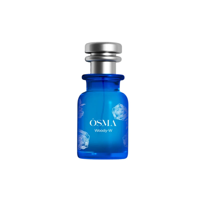 Blue perfume bottle with silver cap on a white background