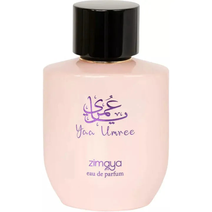 Perfume bottle with black cap and pink body on a white background