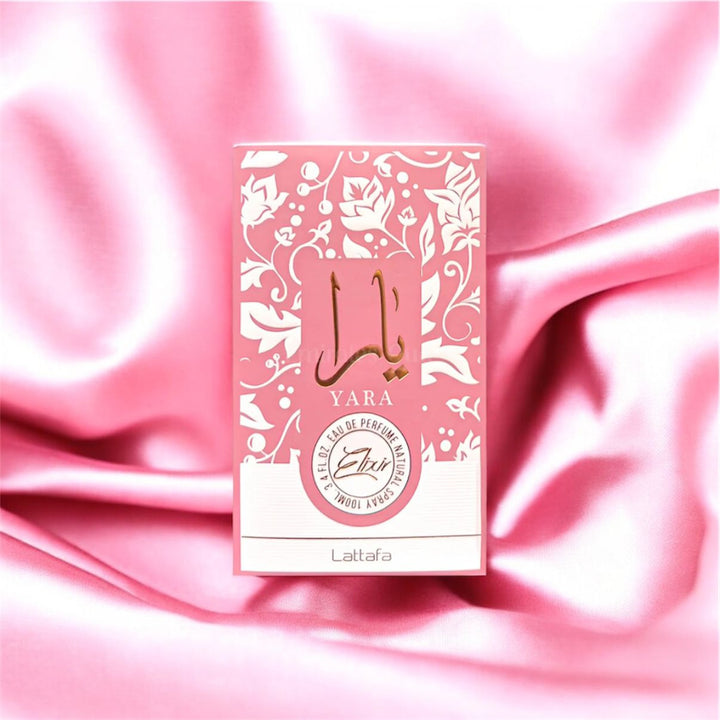 Yara perfume box on a pink satin background
