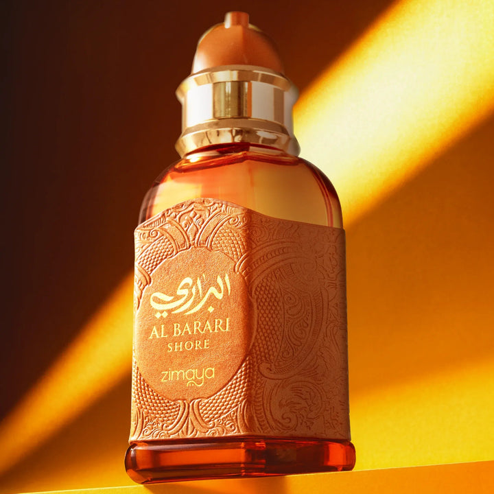 Perfume bottle with intricate design on a warm gradient background